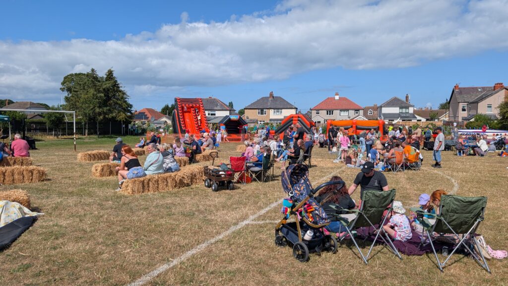 Families attending Rhuddlan Volunteer Fair and Picnic in the Park
